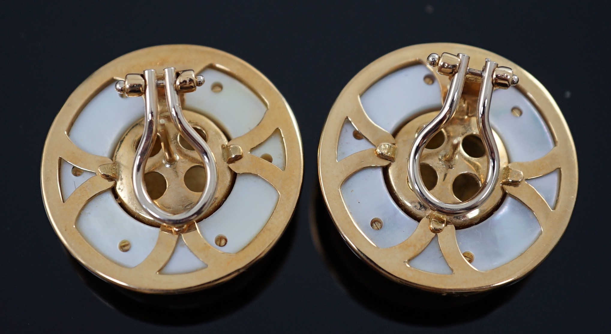 A modern pair of 18ct gold and mother of pearl set disc shape earrings, in Boodle & Dunthorne box